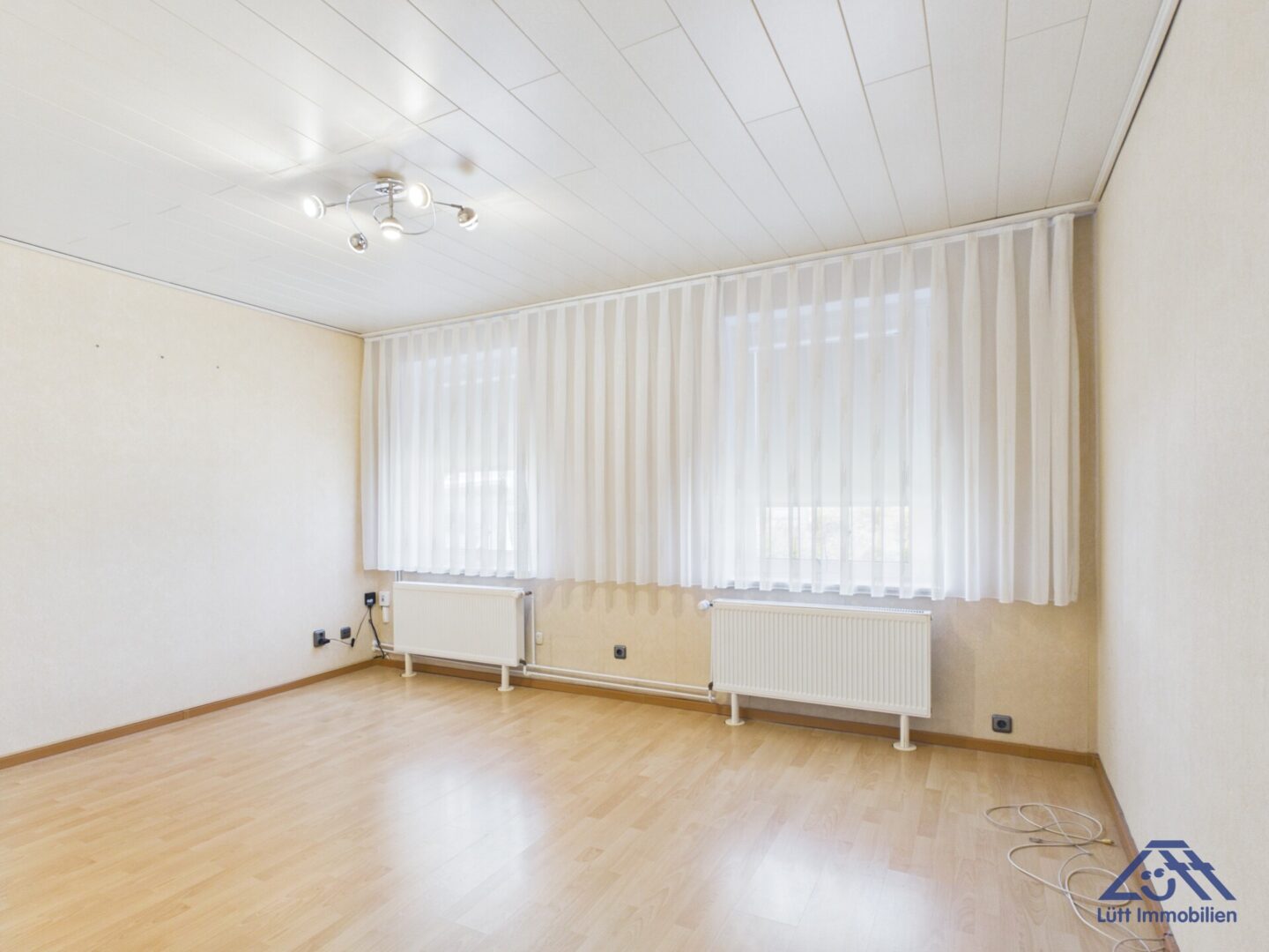 Wohnzimmer - Lütt Immobilien - Kiel