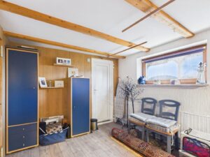 Großer Abstellraum mit Durchgang zur Garage EG - Lütt Immobilien - Schackendorf