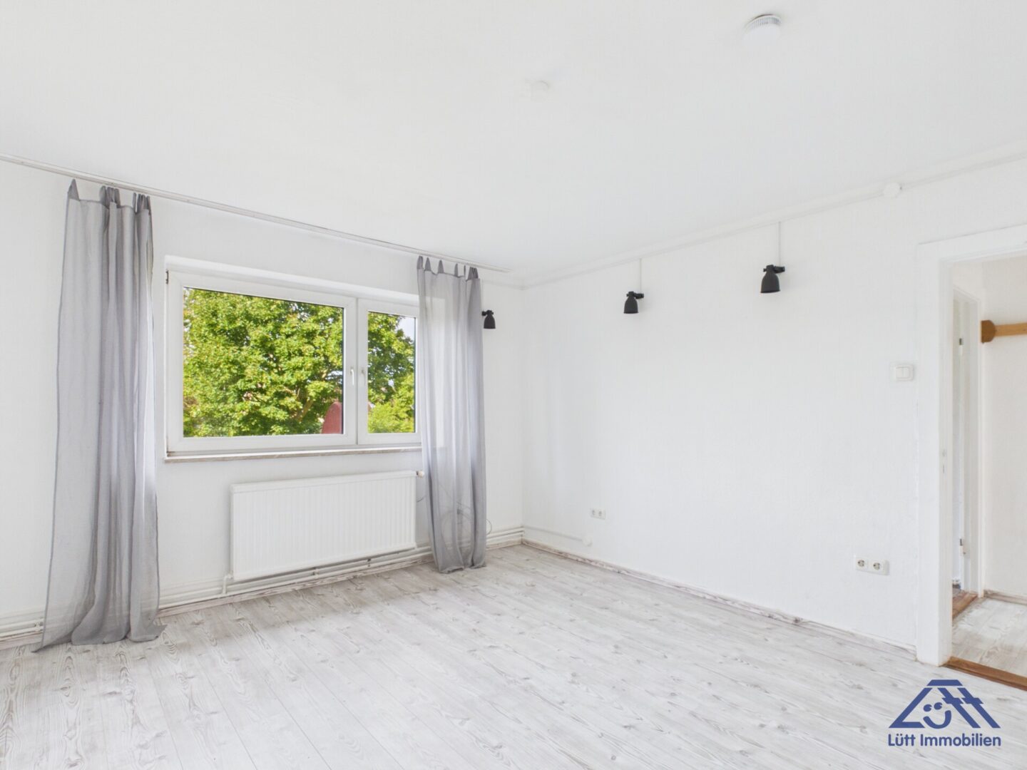 Wohnzimmer - Lütt Immobilien - Kiel