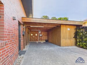 Carport mit Abstellraum - Lütt Immobilien Selent